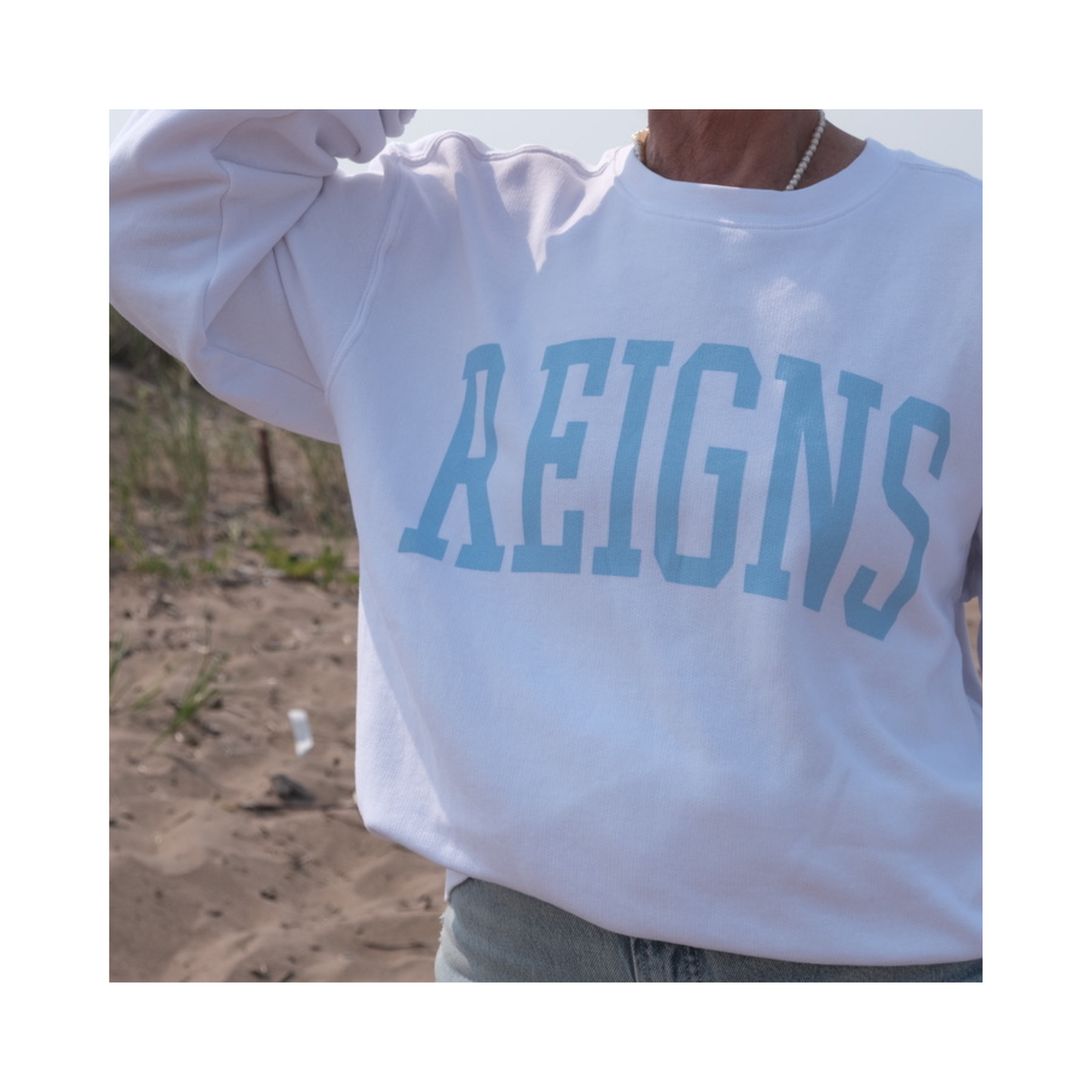 REIGNS white sweatshirt